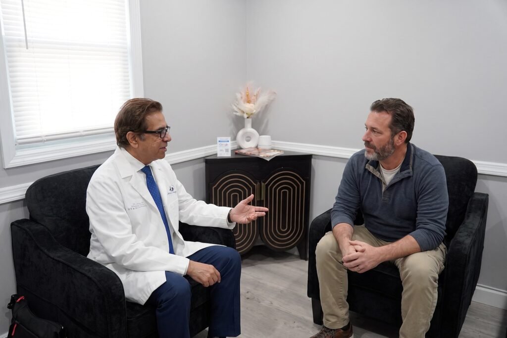 Dr. Abbas talking with a patient in the waiting room at Jersey Shore Psychiatric Services